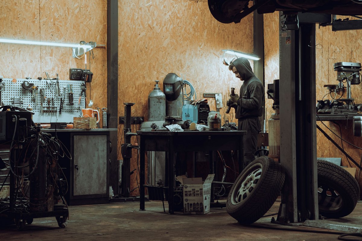 Mechanic working in his repair shop