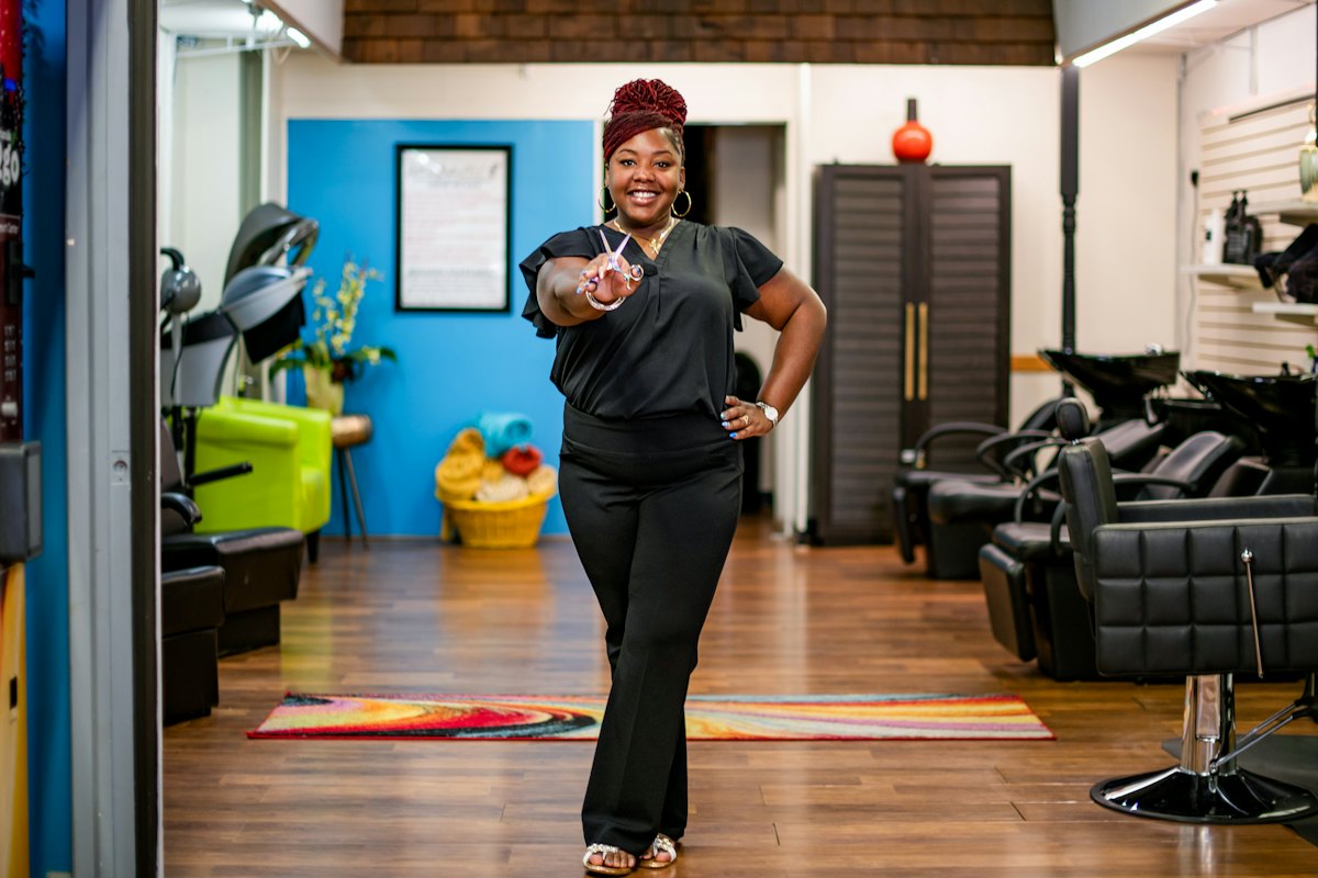 Salon owner standing in her salon
